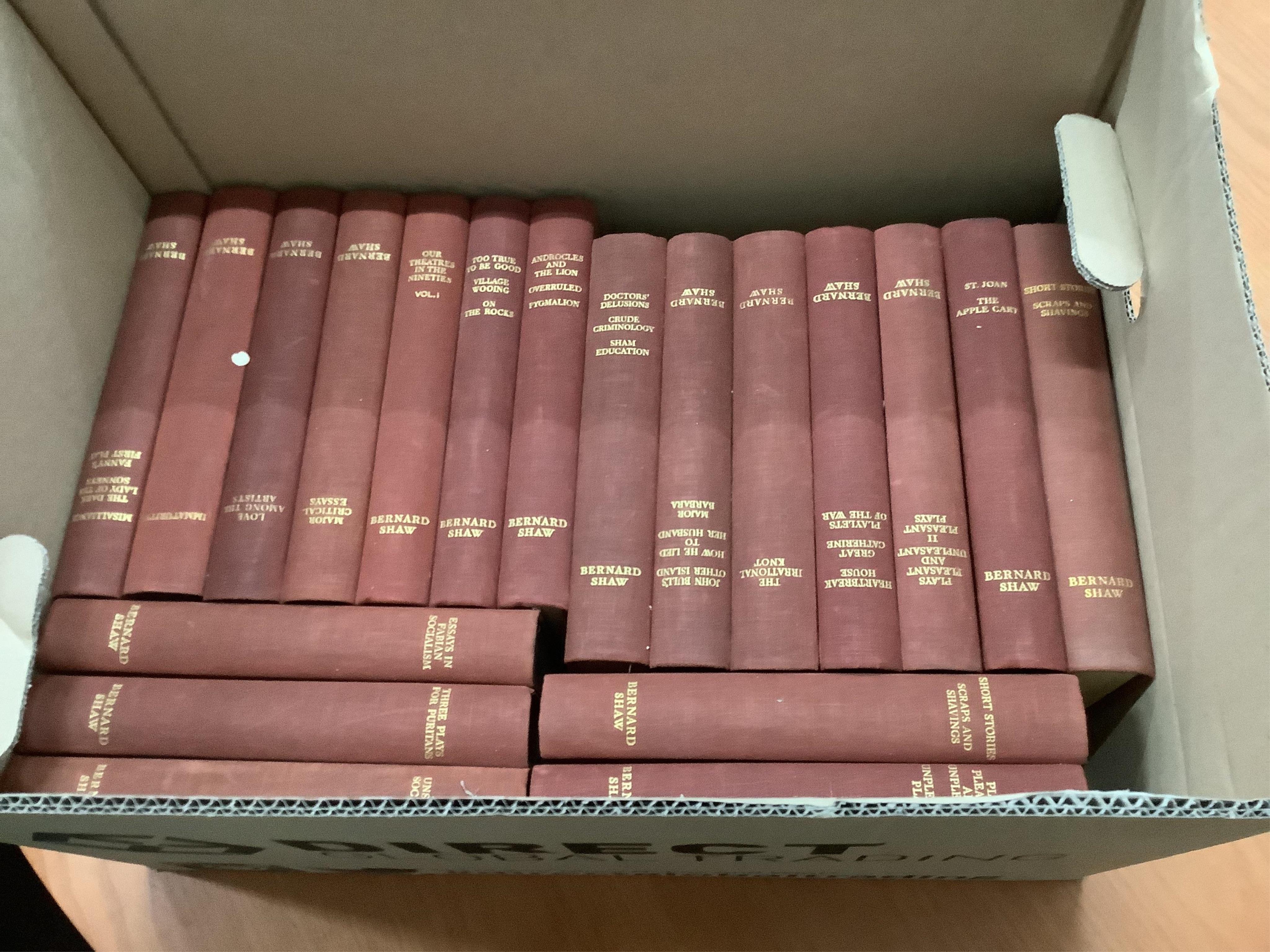 Two boxes of Bernard Shaw books and one box of Thomas Hardy books, approximately 57 volumes